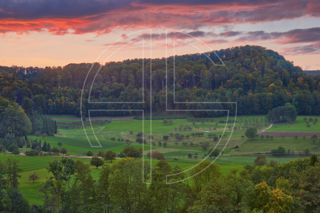 Wooded hills at dusk.