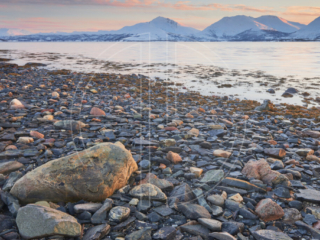 Sunset at a rocky beach.
