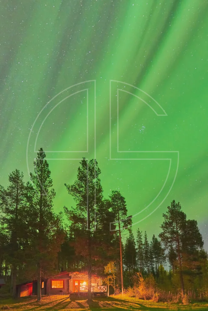 Northern Lights and a cabin in the woods.