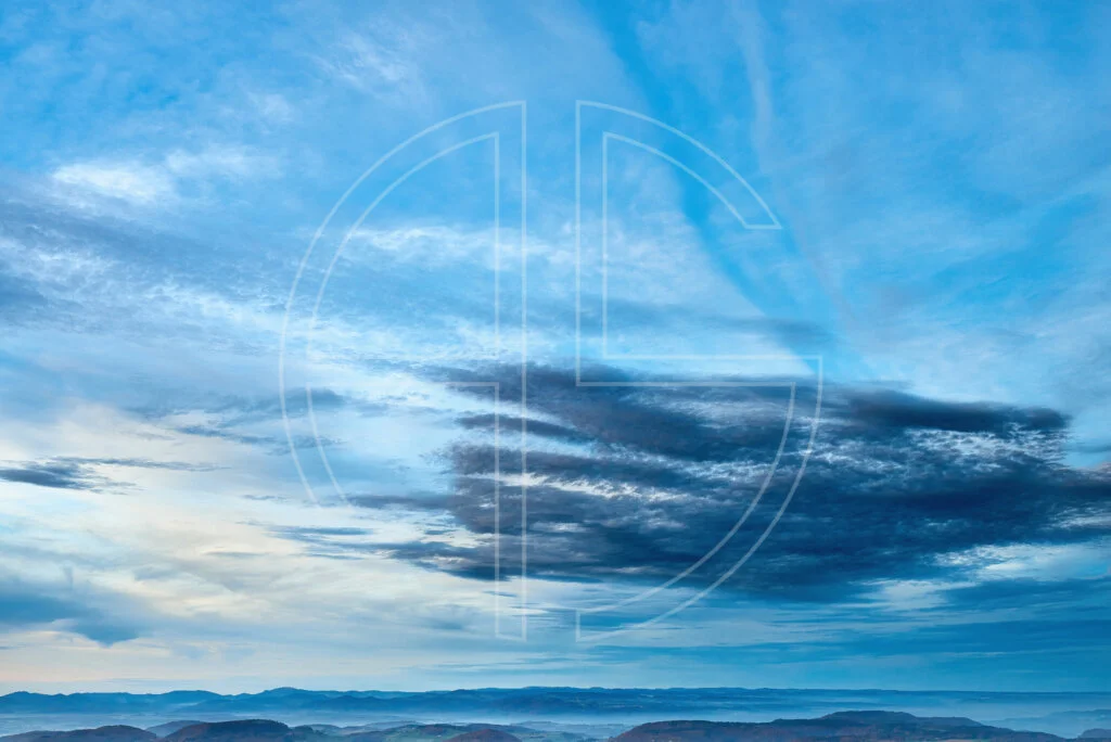 Fortune Favors The Bold A vast blue sky with clouds.