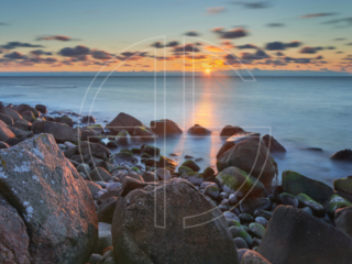Sunset at a rocky beach.