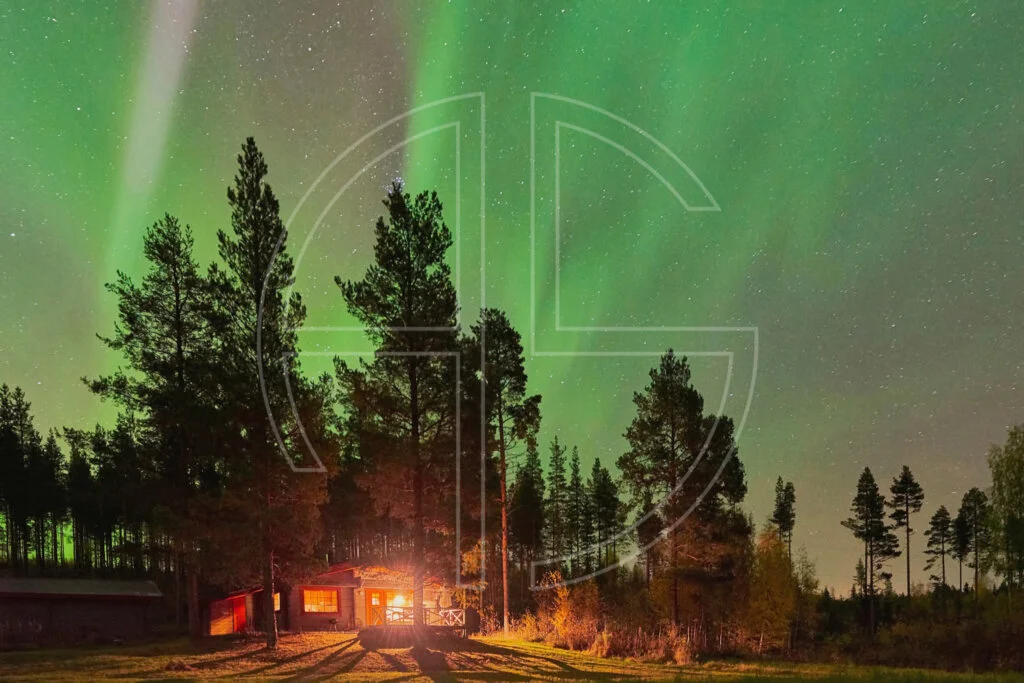 Northern Lights and a cabin in the woods.