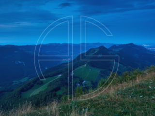 Hilly landscape at the blue hour from a vantage point.