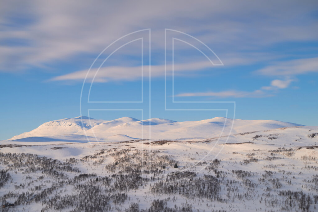 Mountain range in winter in soft light.