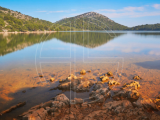 A salt lake and hills.