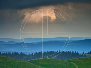 Three hills and an overcast sky.