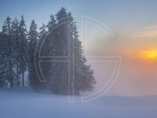 The Eye Of The North Winter landscape at sunset. Fog blocks out the sun.