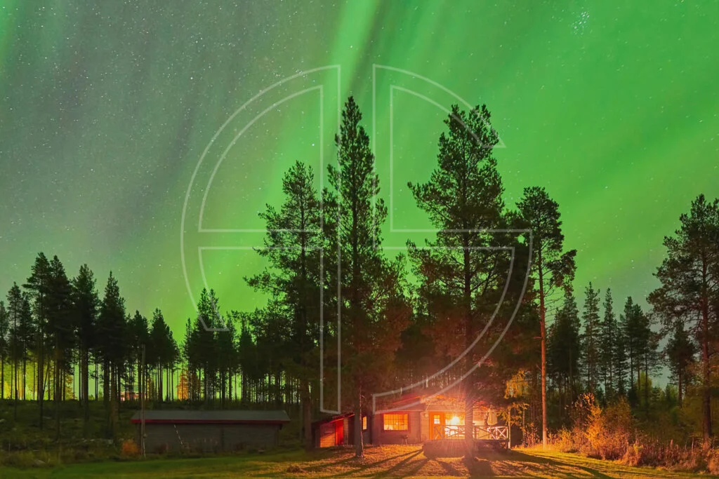 Northern Lights and a cabin in the woods.