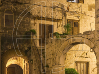 The old part of a town in the evening.