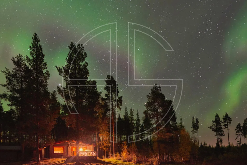 Northern Lights and a cabin in the woods.