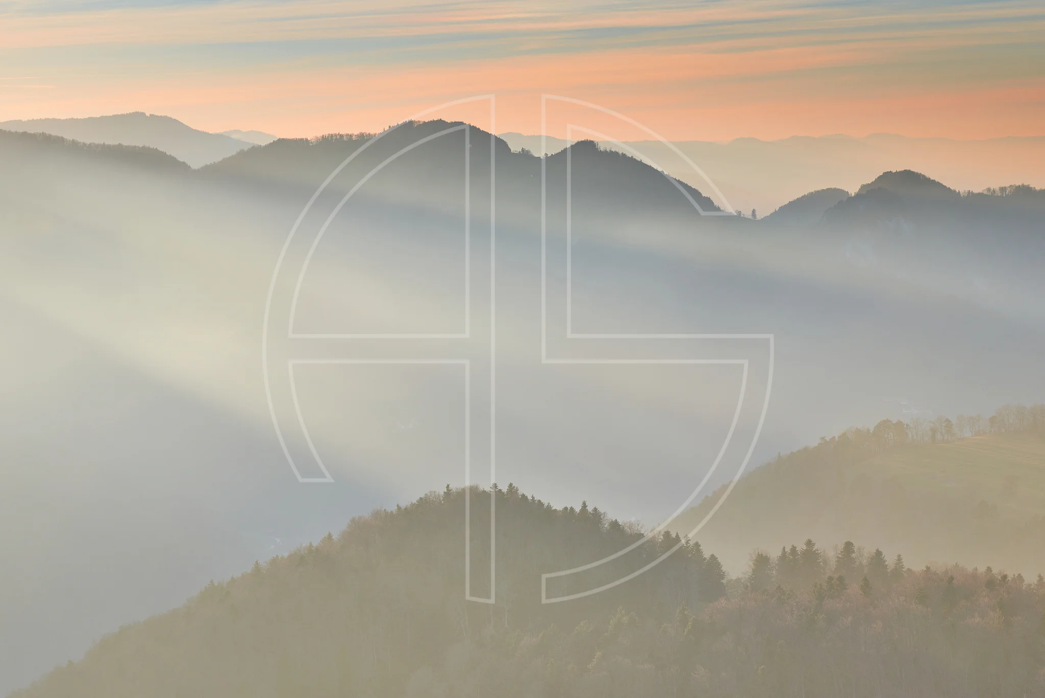 Through Eternity depicts a forested hilly landscape in sun rays.